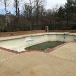 side view before image of dirty pool filled with dirty water and debris