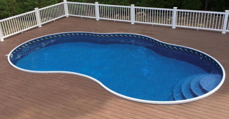 in-ground radiant pool surrounded by wood deck