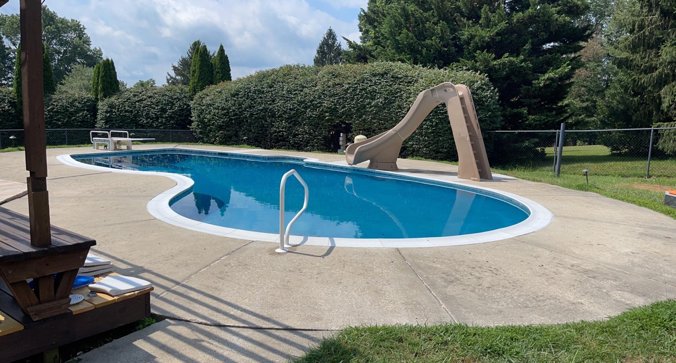 Resurfaced pool with a slide